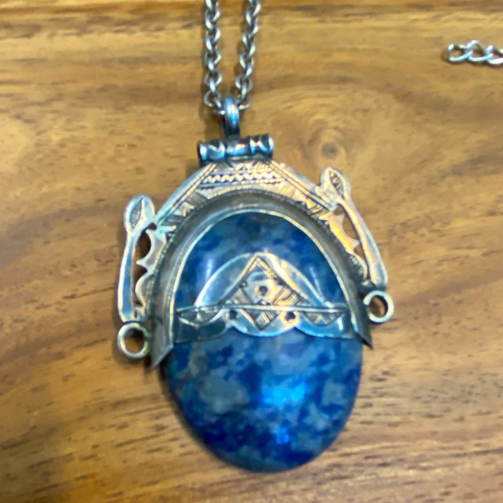 Beautiful blue gemstone pendant in intricately carved Tuareg design setting